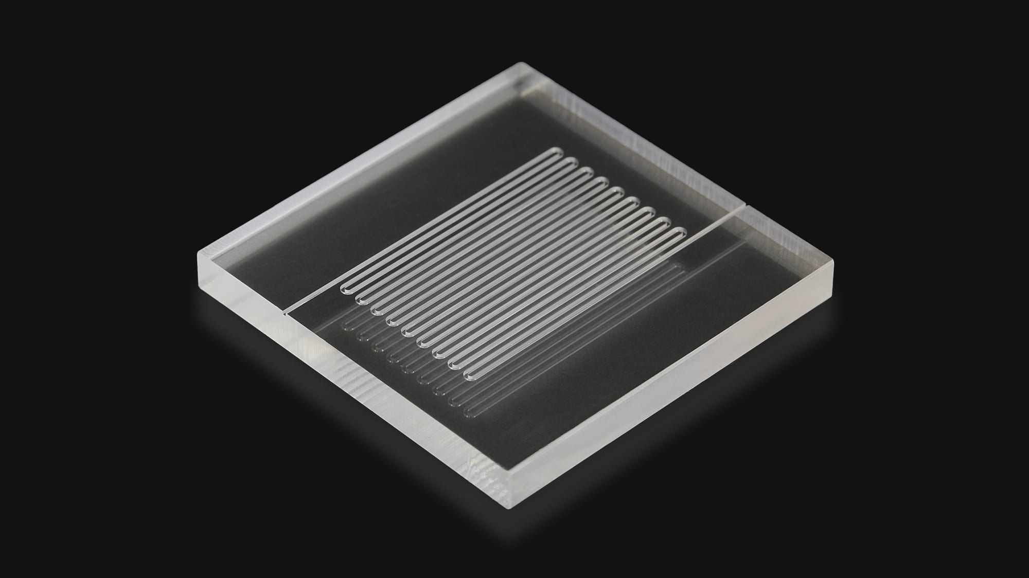 Finished clear acrylic microfluidic chip with serpentine channels